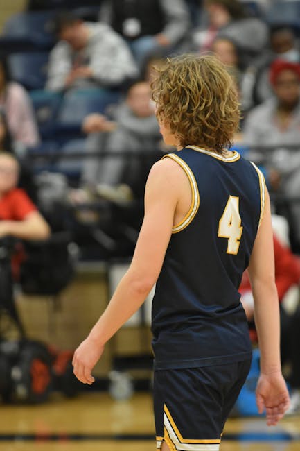Basketball player on the court viewed from behind